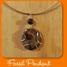 Ammonite fossil pendant with sterling silver neck wire